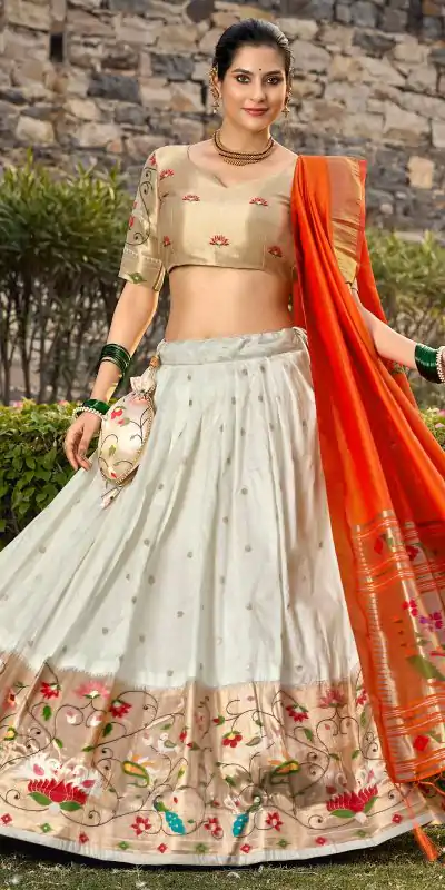 Artful White Color Jacquard Silk Weaving Zari Lehenga Choli