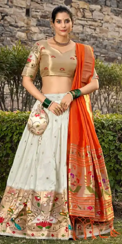 Artful White Color Jacquard Silk Weaving Zari Lehenga Choli
